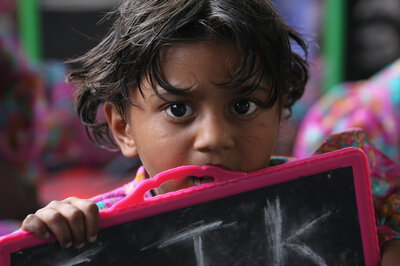 Child with blackboard Thanks to wortundtat, children, who otherwise would have to work at the limekilns in the Indian federal state of Andhra Pradesh, can now go to school.